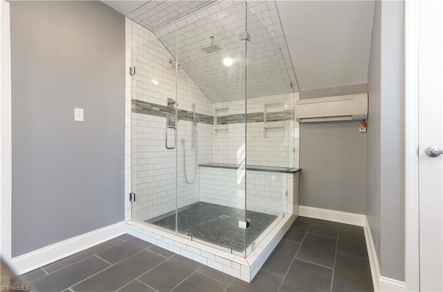 bathroom featuring tile patterned flooring, lofted ceiling, walk in shower, and a wall mounted AC