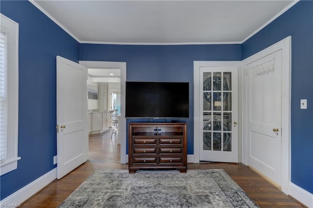 interior space with crown molding and dark wood-type flooring