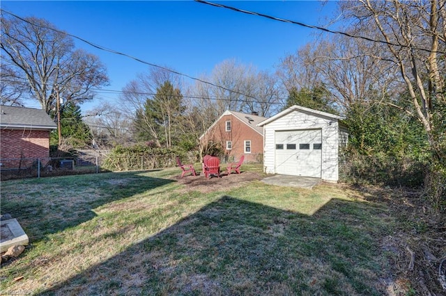 view of yard featuring an outdoor structure and a garage