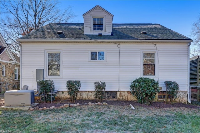 view of side of property with a yard