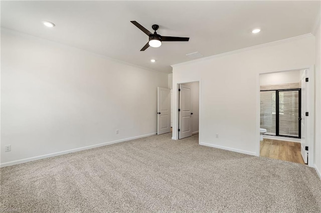 unfurnished bedroom with crown molding, connected bathroom, light carpet, and ceiling fan