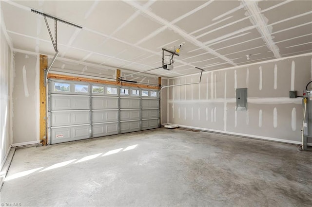 garage featuring a garage door opener and electric panel