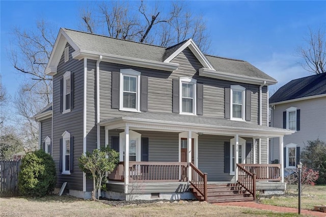 view of front of property with a porch and roof with shingles