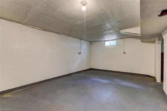 basement featuring a textured ceiling