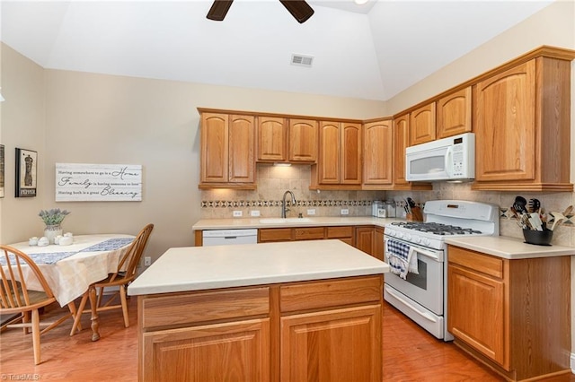 503 Sweetwater Ct, Clemmons, NC 27012 - kitchen with vaulted ceiling, white appliances, a sink, and light wood-style flooring