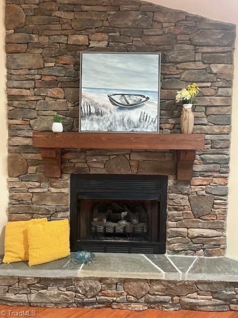 503 Sweetwater Ct, Clemmons, NC 27012 - details with a stone fireplace and wood finished floors