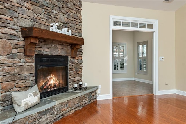 503 Sweetwater Ct, Clemmons, NC 27012 - room details featuring baseboards, wood finished floors, visible vents, and a fireplace