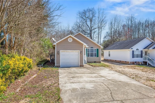 view of front of house with a garage, driveway, and crawl space