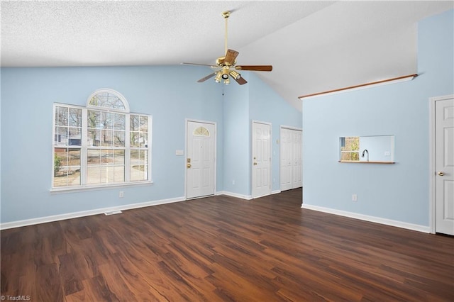 unfurnished living room with a ceiling fan, visible vents, wood finished floors, baseboards, and a textured ceiling