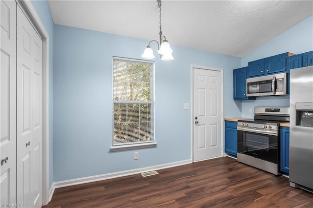 kitchen with visible vents, dark wood-type flooring, blue cabinetry, appliances with stainless steel finishes, and vaulted ceiling