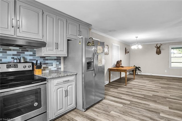 kitchen with gray cabinetry, tasteful backsplash, crown molding, a chandelier, and appliances with stainless steel finishes