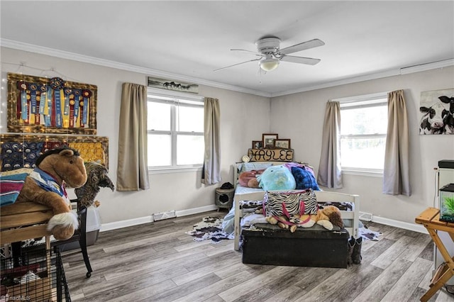 bedroom featuring ceiling fan, wood-type flooring, and ornamental molding