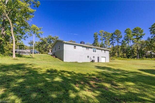 rear view of property with a yard