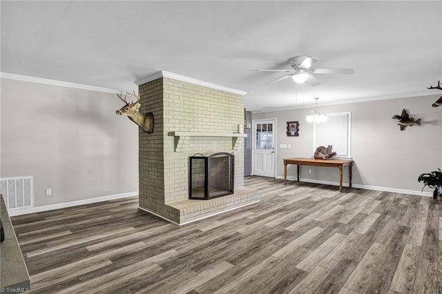 unfurnished living room with crown molding, a fireplace, ceiling fan, and hardwood / wood-style floors