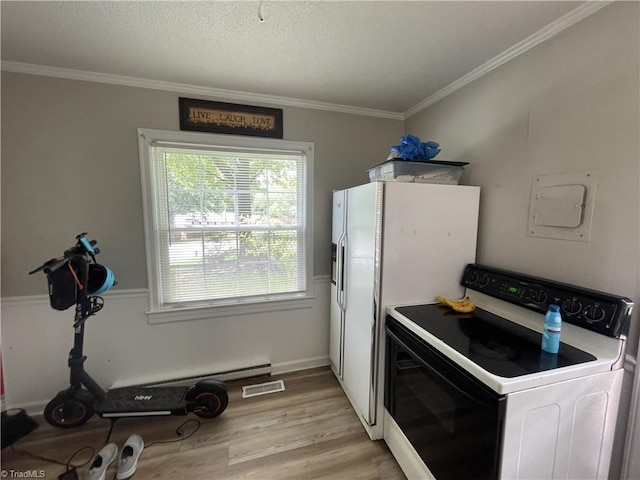 2820 Shady Lawn Dr, Greensboro, NC 27408 - kitchen featuring washer / dryer, ornamental molding, light wood-type flooring, white appliances, and a textured ceiling