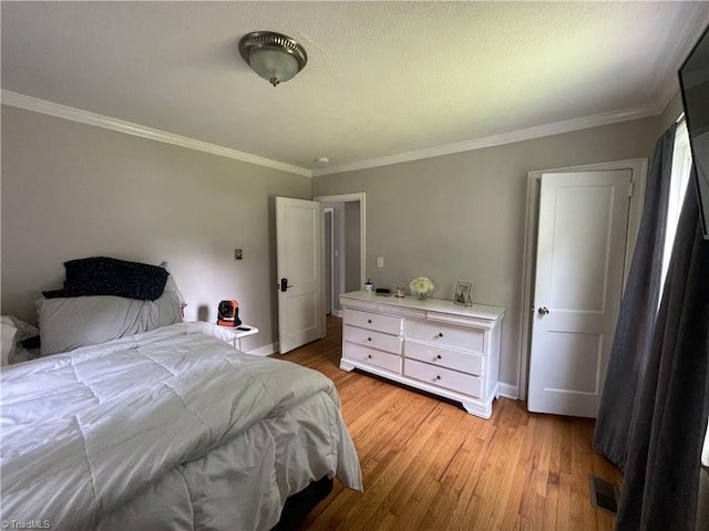 2820 Shady Lawn Dr, Greensboro, NC 27408 - bedroom with light wood-type flooring and ornamental molding