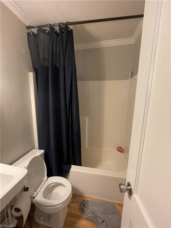 2820 Shady Lawn Dr, Greensboro, NC 27408 - full bathroom featuring crown molding, shower / tub combo, a textured ceiling, and wood finished floors