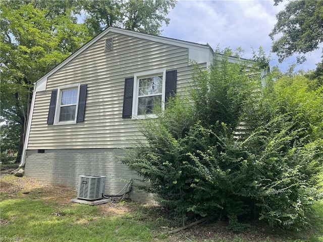 2820 Shady Lawn Dr, Greensboro, NC 27408 - view of side of home with a central AC unit and crawl space