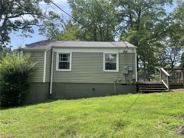 2820 Shady Lawn Dr, Greensboro, NC 27408 - view of home's exterior featuring a lawn, a wooden deck, and crawl space