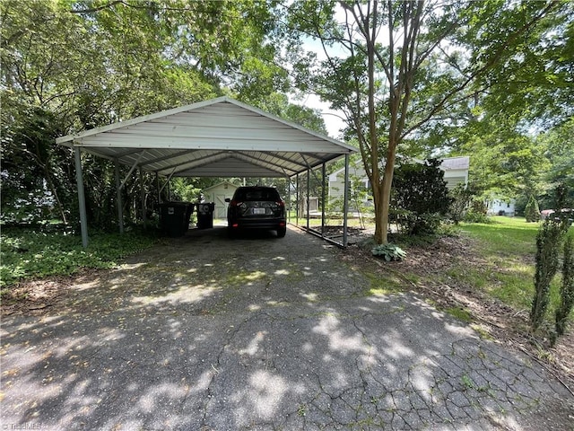 2820 Shady Lawn Dr, Greensboro, NC 27408 - view of parking / parking lot featuring asphalt driveway and a carport