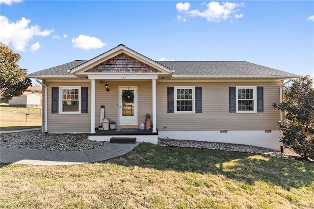 view of front facade with covered porch and a front yard