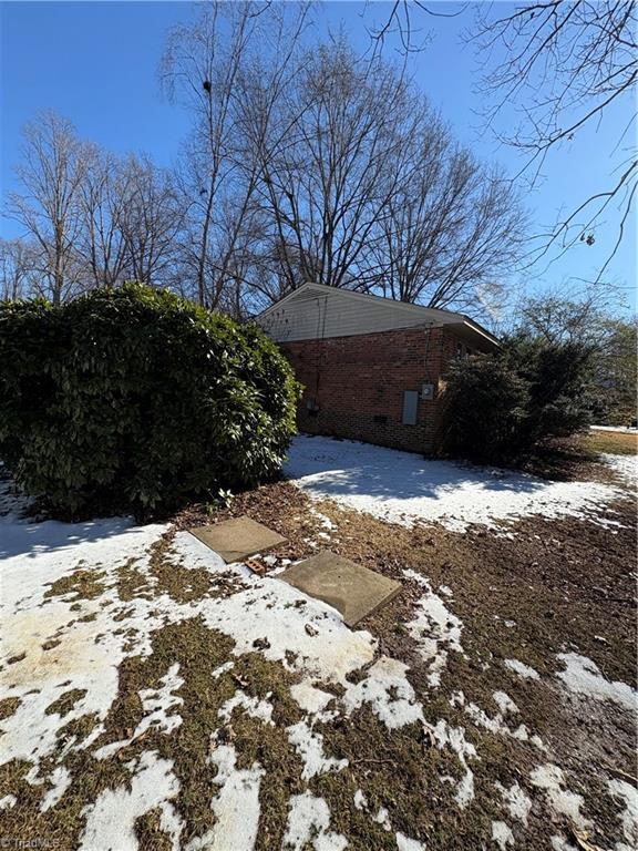 view of snow covered property