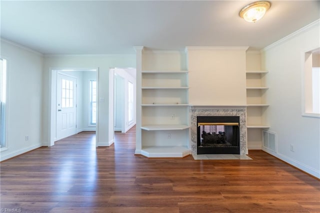 unfurnished living room with hardwood / wood-style flooring, a multi sided fireplace, and ornamental molding