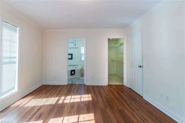 unfurnished room with hardwood / wood-style flooring, plenty of natural light, and ornamental molding