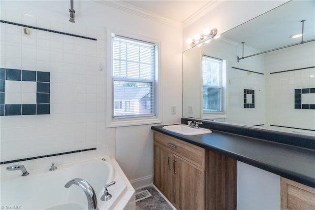 bathroom with a washtub, a healthy amount of sunlight, ornamental molding, and vanity