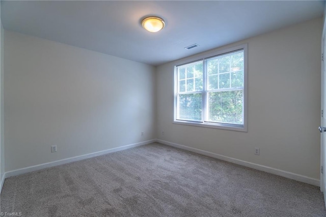 spare room with carpet flooring