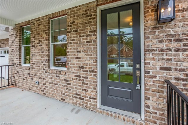 entrance to property featuring a porch