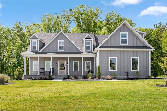 craftsman house featuring a porch and a front lawn