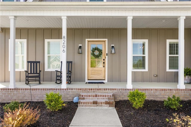 property entrance featuring a porch