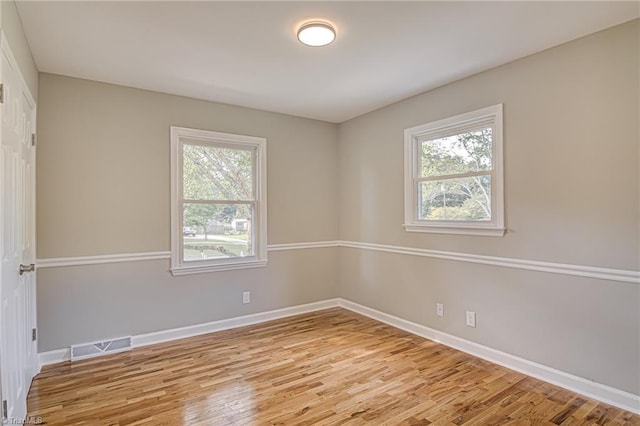 unfurnished room featuring light wood-type flooring