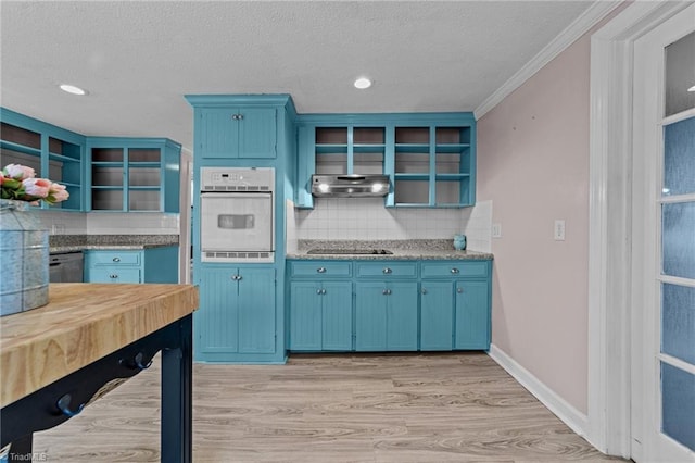 kitchen featuring white oven, blue cabinetry, light wood-type flooring, under cabinet range hood, and open shelves