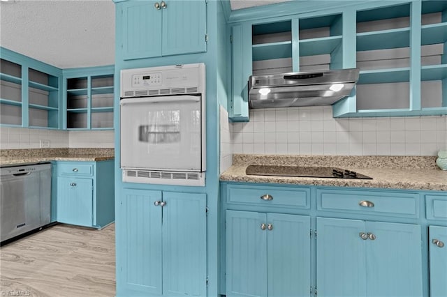 kitchen with range hood, open shelves, stainless steel dishwasher, blue cabinets, and oven