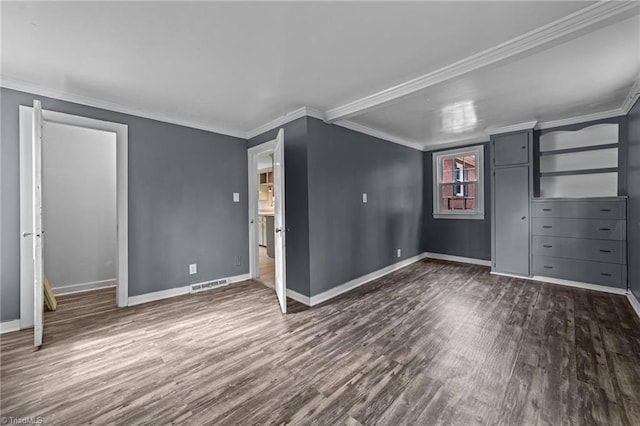 unfurnished bedroom featuring dark wood-style floors, visible vents, crown molding, and baseboards