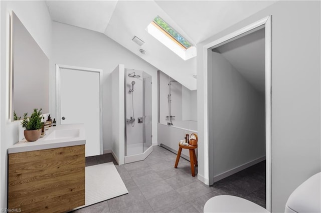 3542 Wayne White Rd, Climax, NC 27233 - bathroom featuring vaulted ceiling, a skylight, vanity, a shower stall, and tile patterned floors