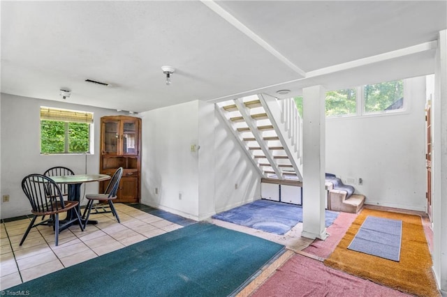 3542 Wayne White Rd, Climax, NC 27233 - living room with stairway and tile patterned flooring