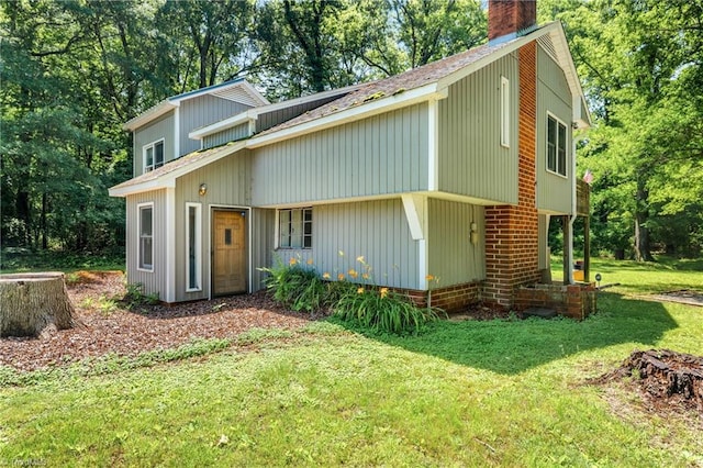 3542 Wayne White Rd, Climax, NC 27233 - view of front of property with a chimney, a front yard, and view of scattered trees