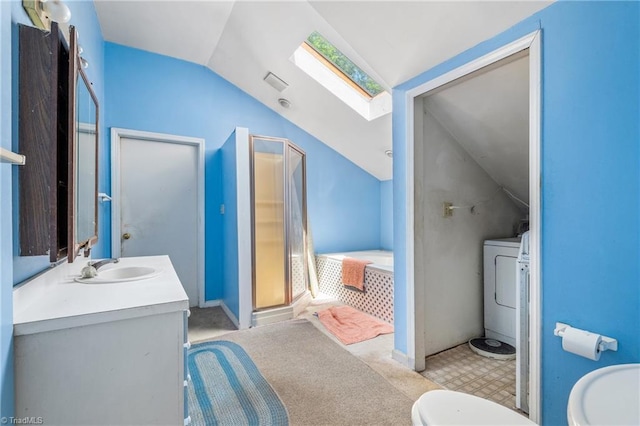 3542 Wayne White Rd, Climax, NC 27233 - full bathroom with lofted ceiling, vanity, a garden tub, washer / clothes dryer, and a skylight