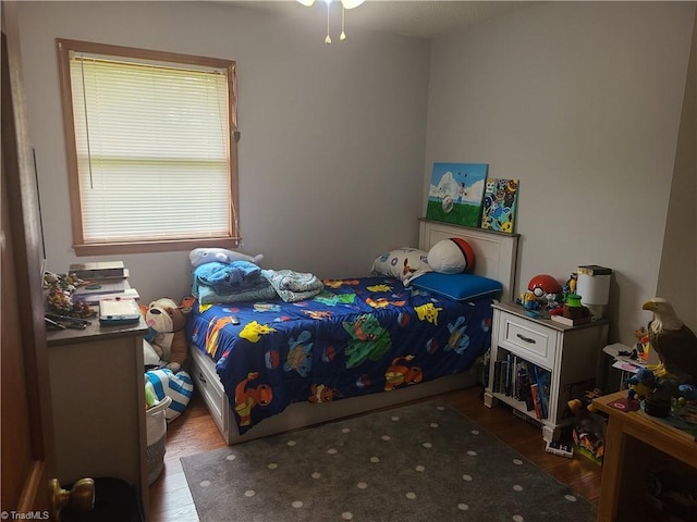 bedroom with wood finished floors