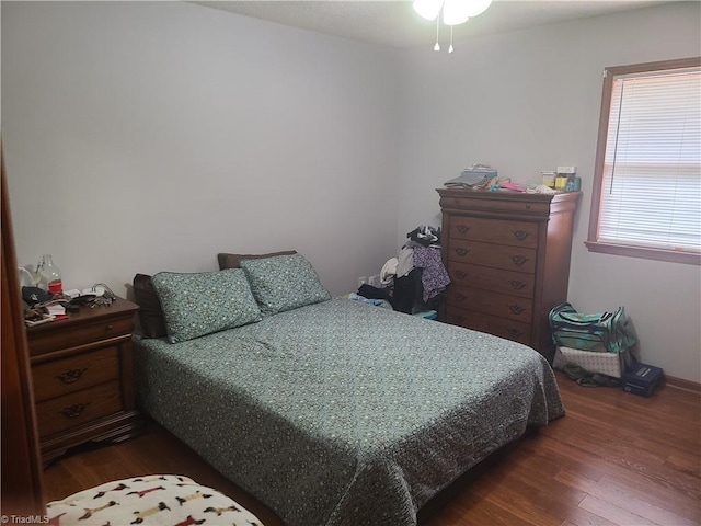 bedroom featuring dark wood-style floors