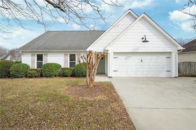 view of front of house featuring a garage and a front yard