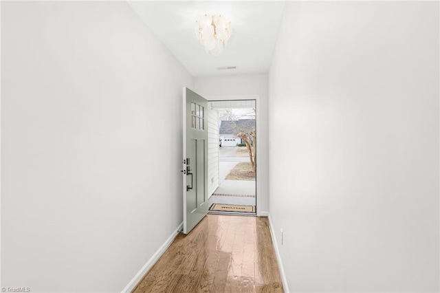 doorway to outside featuring hardwood / wood-style flooring