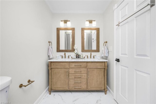 bathroom featuring vanity, crown molding, and toilet