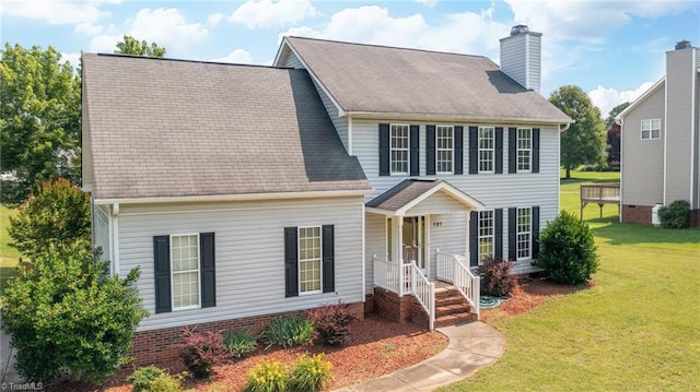 131 Hickory Creek Ct, Winston-Salem, NC 27107 - colonial inspired home featuring a front yard and a chimney