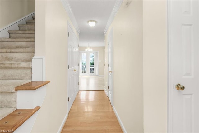 131 Hickory Creek Ct, Winston-Salem, NC 27107 - hallway with light wood-style flooring, stairway, and ornamental molding