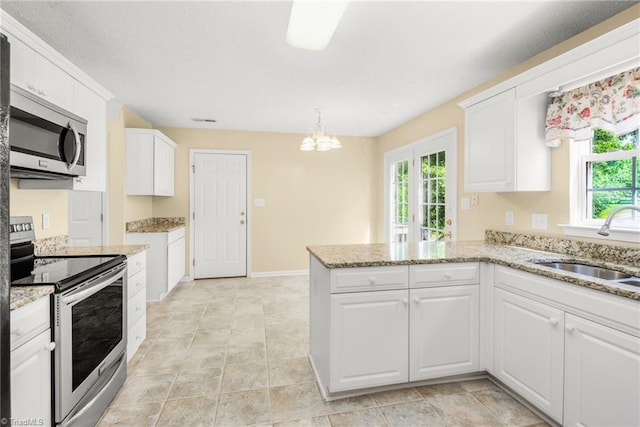 131 Hickory Creek Ct, Winston-Salem, NC 27107 - kitchen featuring stainless steel appliances, plenty of natural light, and white cabinetry