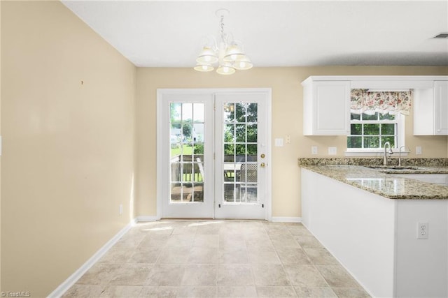 131 Hickory Creek Ct, Winston-Salem, NC 27107 - unfurnished dining area with a sink and a chandelier